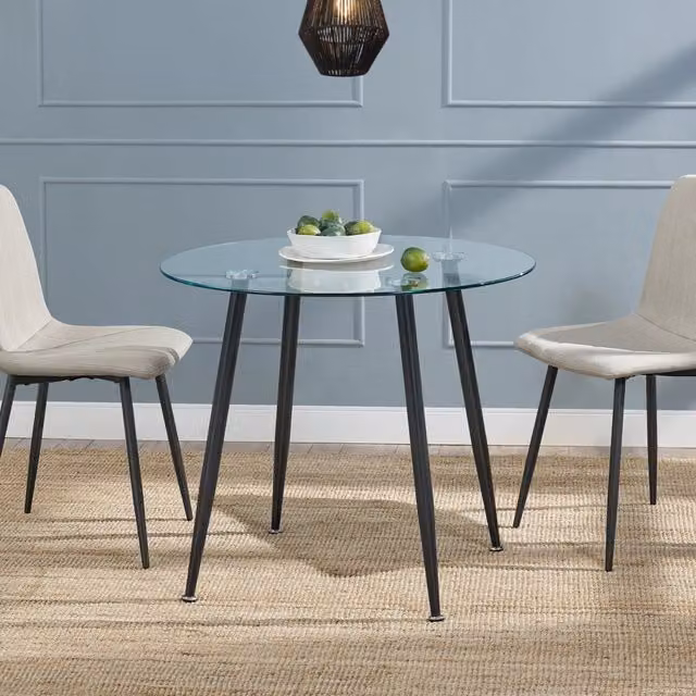 Tavolo rotondo moderno Humppila en.casa con piano in vetro trasparente e gambe in acciaio nero, Diametro: 87 cm, Altezza: 75 cm