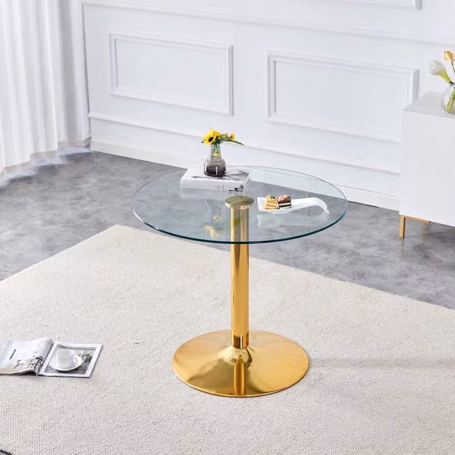 Tavolo rotondo moderno Mivray con piano in vetro trasparente e base in metallo dorato, Diametro: 85 cm, Altezza: 76 cm