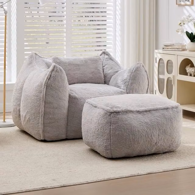 Divano a sacco Minimal in pelliccia ecologica grigio con cuscino e poggiapiedi per soggiorno e camera da letto